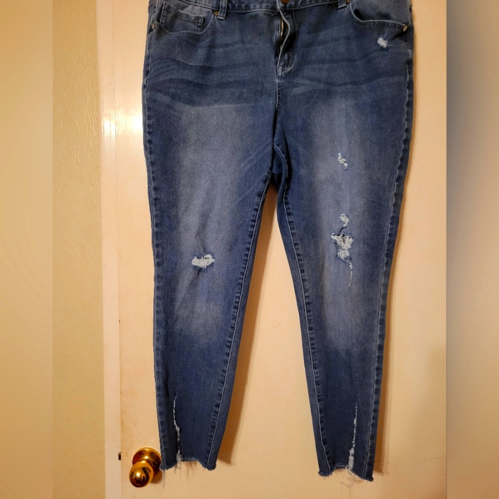 Mid rise lightly distressed blue jeans